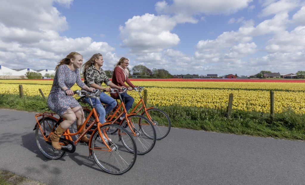 Met de fiets of scooter